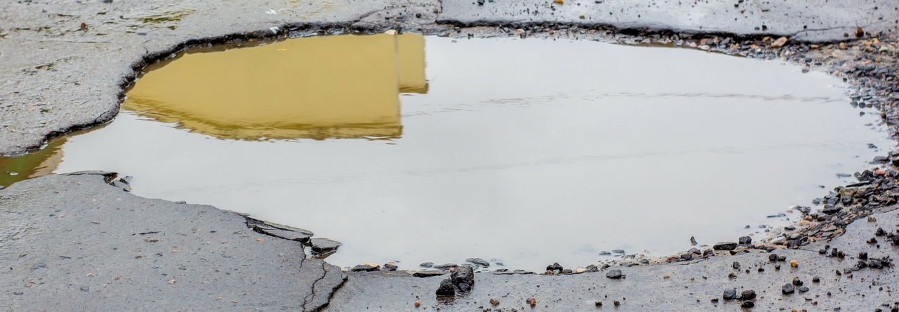 Pothole filled with water