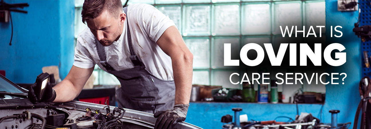 A mechanic fixing a car featured in a blog post about Zimbrick's Loving Care Service