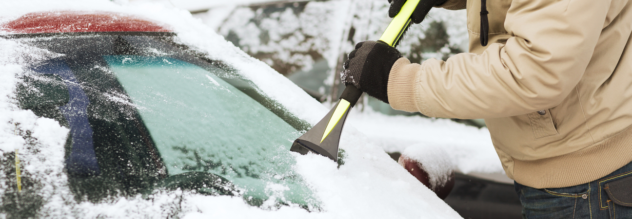 cleaning off a frozen windshield